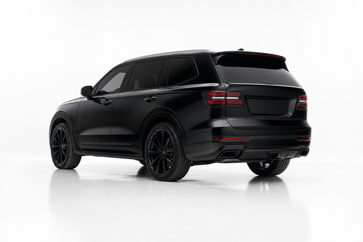 Black SUV with limo tint in the Autotint studio